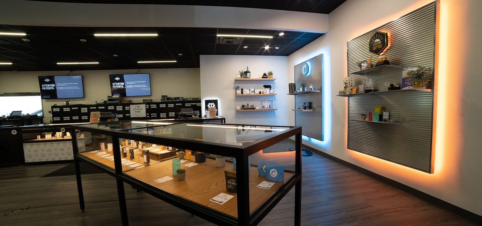 Interior of Beehive Farmacy cannabis dispensary with glass display cases and product shelves